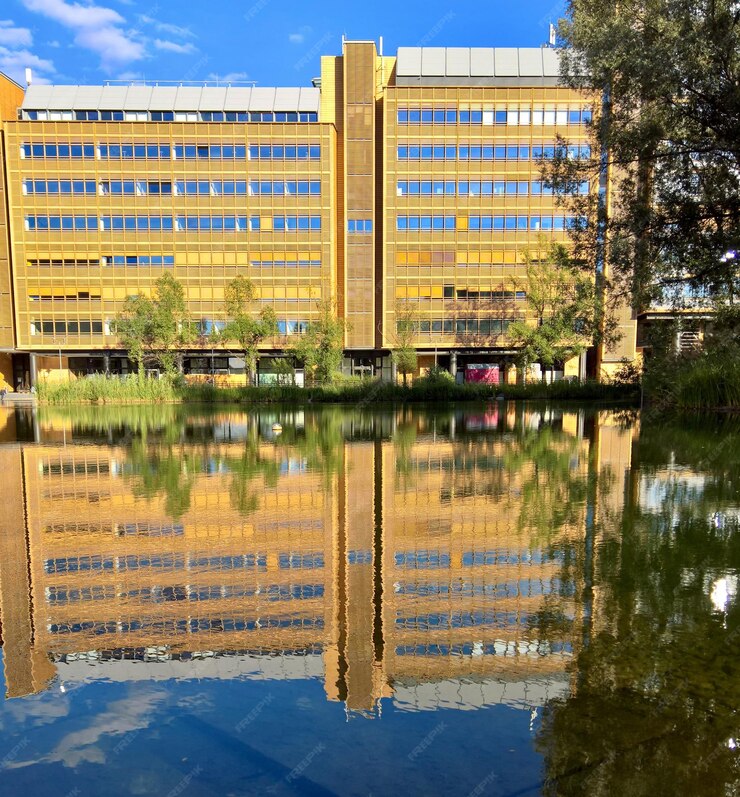 reflection-building-lake-against-sky_1048944-15839965